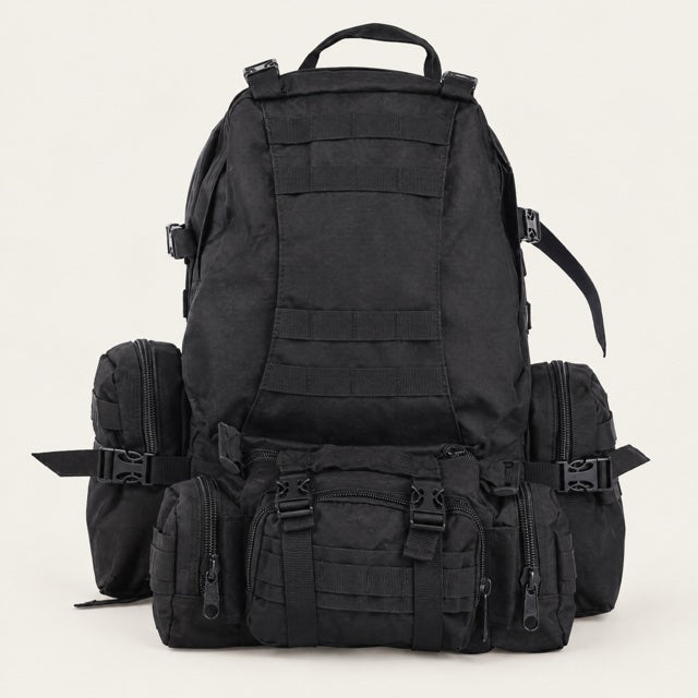 Studio view of 50L MOLLE Assault Pack on a warm neutral background