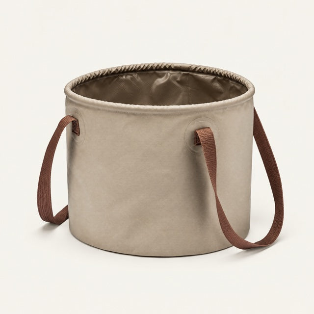 Studio view of Collapsible Water Bucket on a warm neutral background